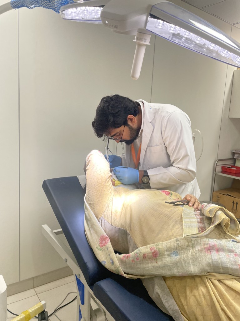 Skin specialist treating patient in Faridabad